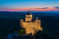 Aerial view about castle of HollÃÂ³kÃâ at dusk.